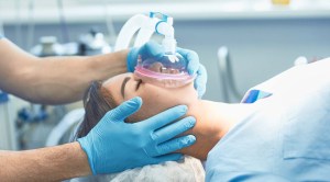 Woman getting sedated for dental anesthesia